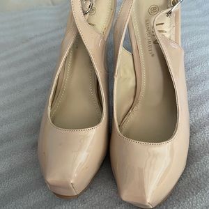 Beige high heel shoes